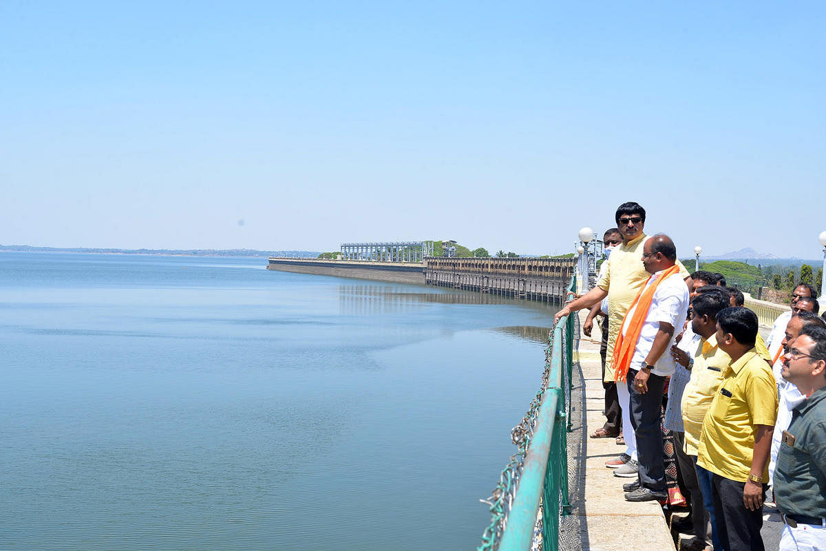 Tourism Minister C P Yogeeshwara visits Krishnarajasagar dam in Srirangapatna, Mandya district on Saturday. Credit: DH Photo