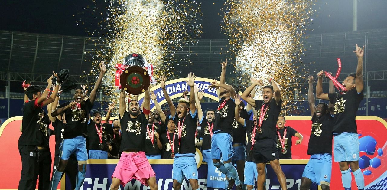 Mumbai City FC players celebrate with the trophy. Credit: PTI Photo