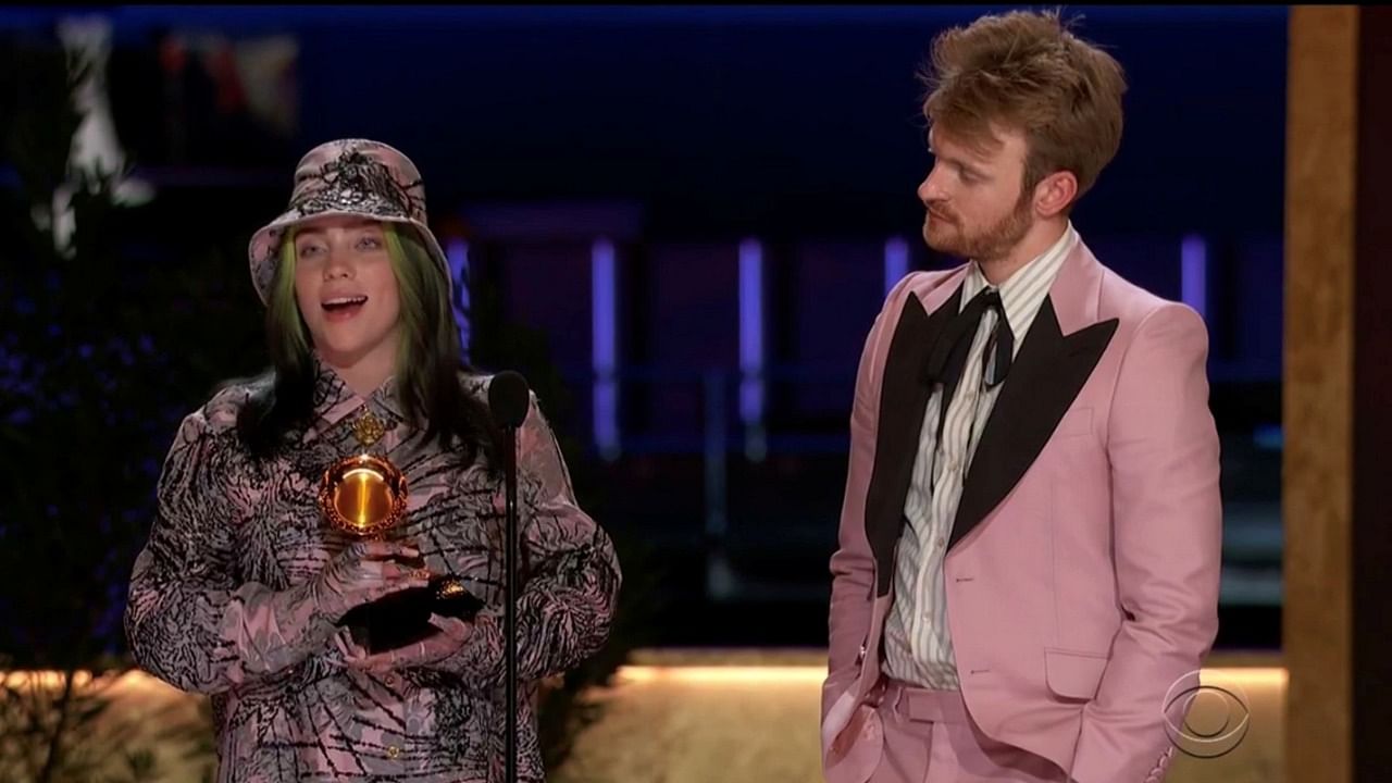 Billie Eilish, with her brother Finneas O'Connell, accepts the Grammy for Record of the Year for Everything I Wanted.' Credit: Reuters 