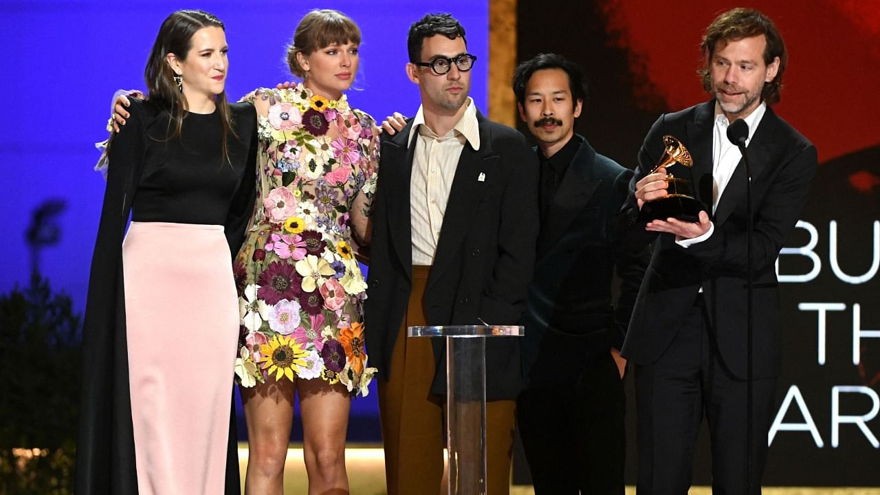 (L-R) Laura Sisk, Taylor Swift, Jack Antonoff, Jonathan Low and Aaron Dessner accept the Album of the Year award for ‘Folklore’ onstage during the 63rd Annual Grammy Awards Ceremony broadcast live from the Staples Center in Los Angeles. Credit: AFP Photo