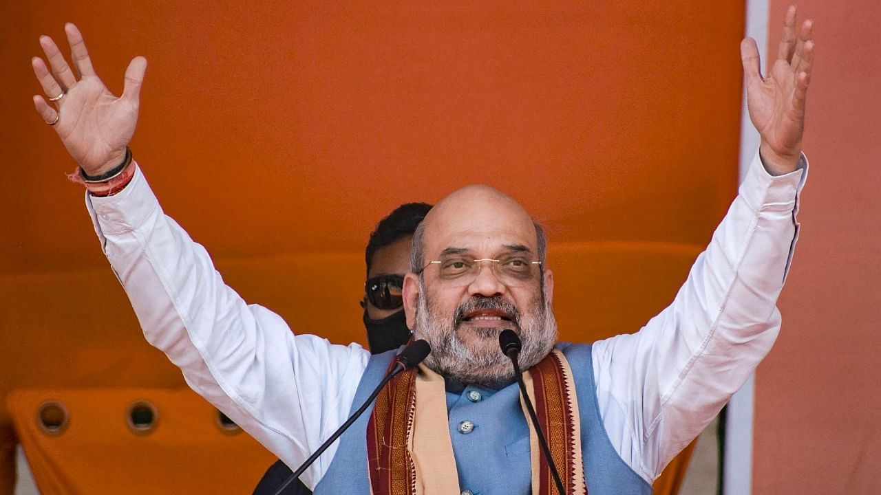 Union Home Minister and BJP leader Amit Shah addresses an election campaign rally, ahead of the State Assembly polls, in Bankura. Credit: PTI Photo