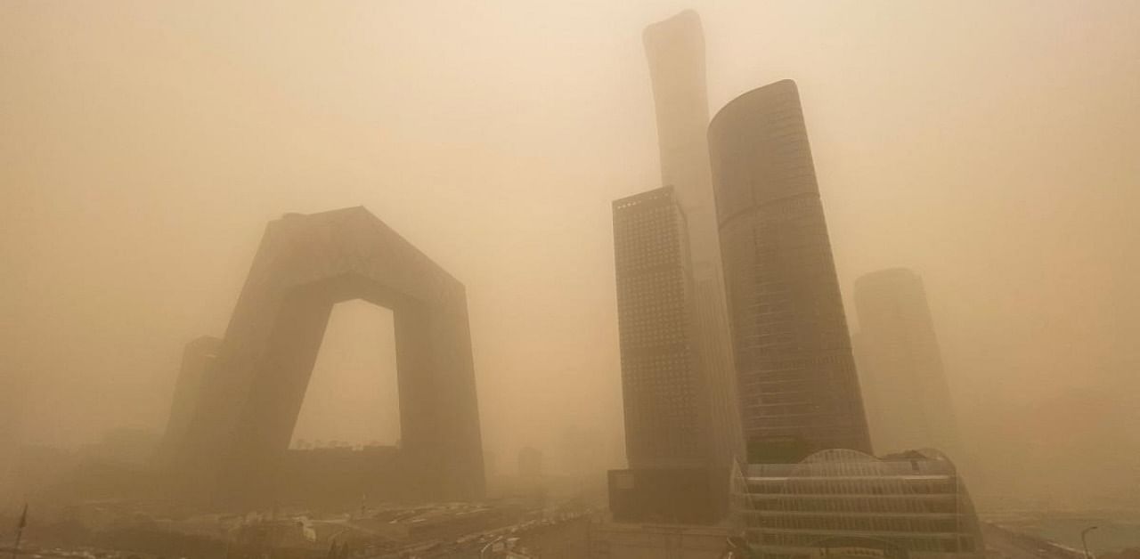 Buildings are seen in the central business district of Beijing during a sandstorm on March 15, 2021. Credit: AFP Photo