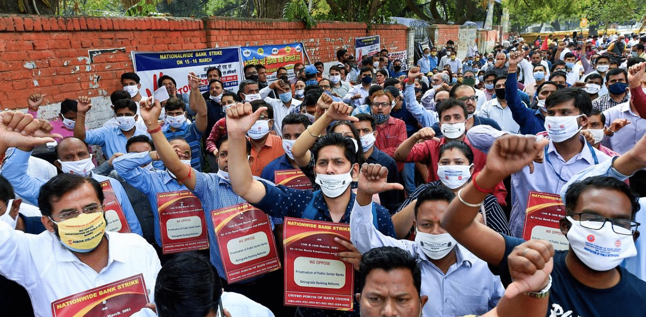 Bank employees raise slogans during a protest in support of the two-day nationwide strike. Credit: PTI Photo