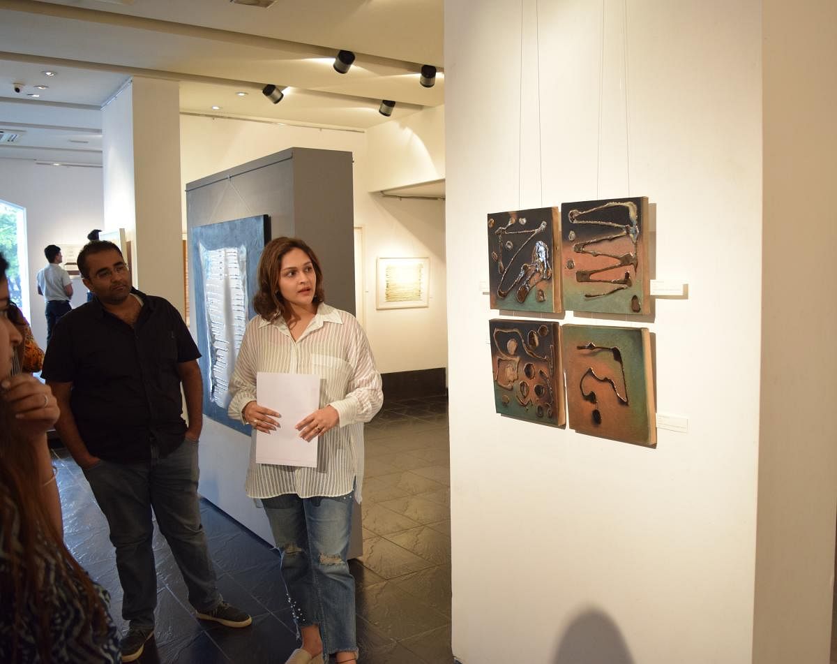 Sanjana Shah conducting a walkthrough at the Tao Art Gallery in Mumbai.