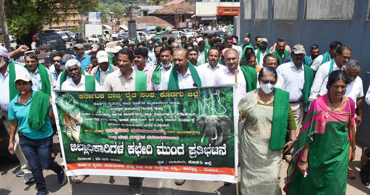 Farmers took out a protest rally in Madikeri on Monday.