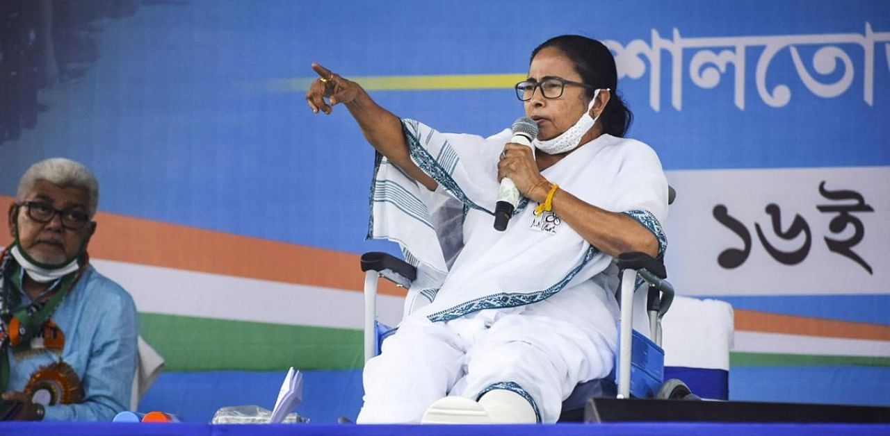 West Bengal CM and TMC supremo Mamata Banerjee, sitting on a wheel-chair, addresses an election campaign rally ahead of state assembly polls, in Bankura, Tuesday, March 16, 2021. Credit: PTI Photo