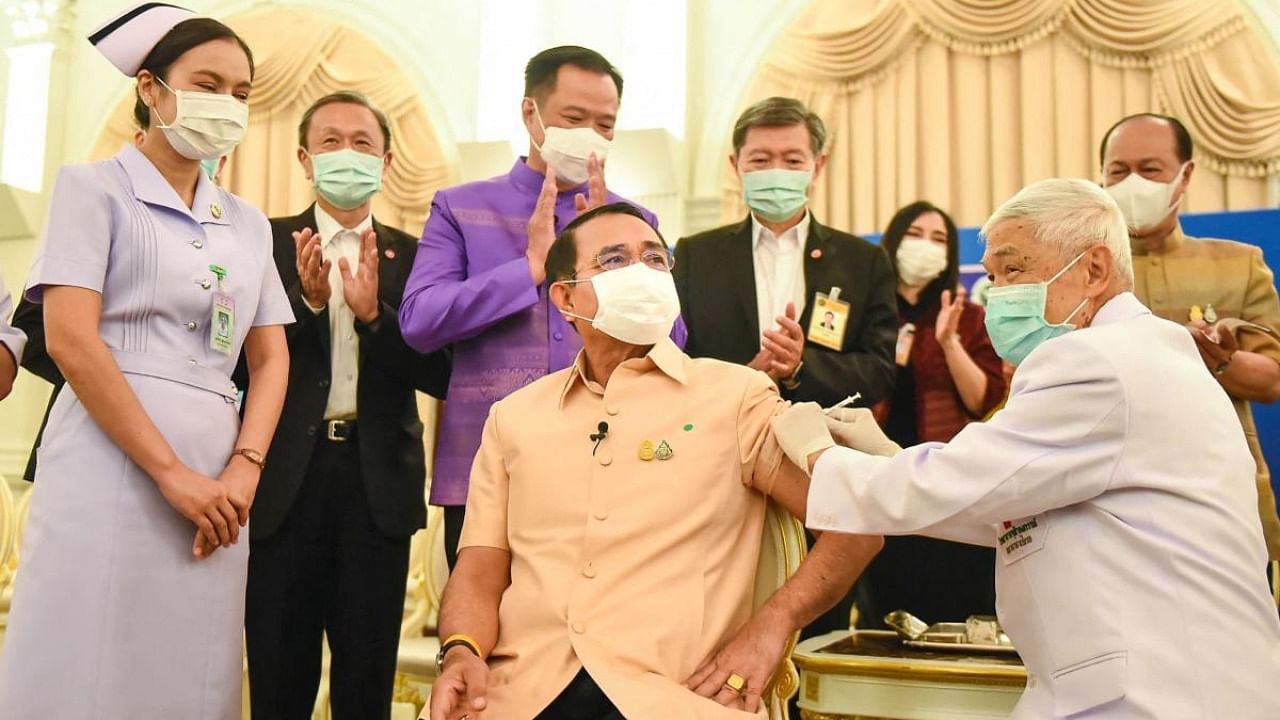 This handout from the Royal Thai Government shows Thailand's Prime Minister Prayut Chan-O-Cha (C) receiving the Oxford/AstraZeneca Covid-19 coronavirus vaccine in Bangkok. Credit: AFP/Royal Thai Government.