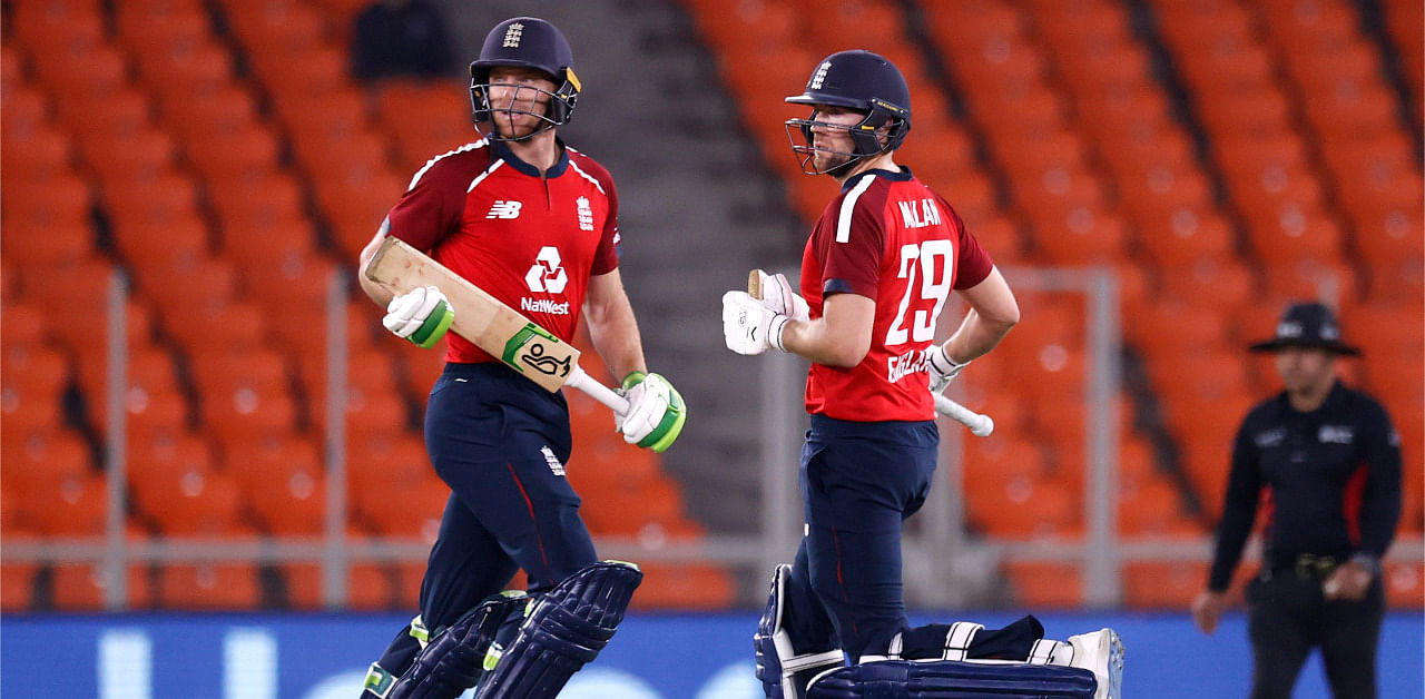 England's Jos Buttler and Dawid Malan in action. Credit: Reuters Photo