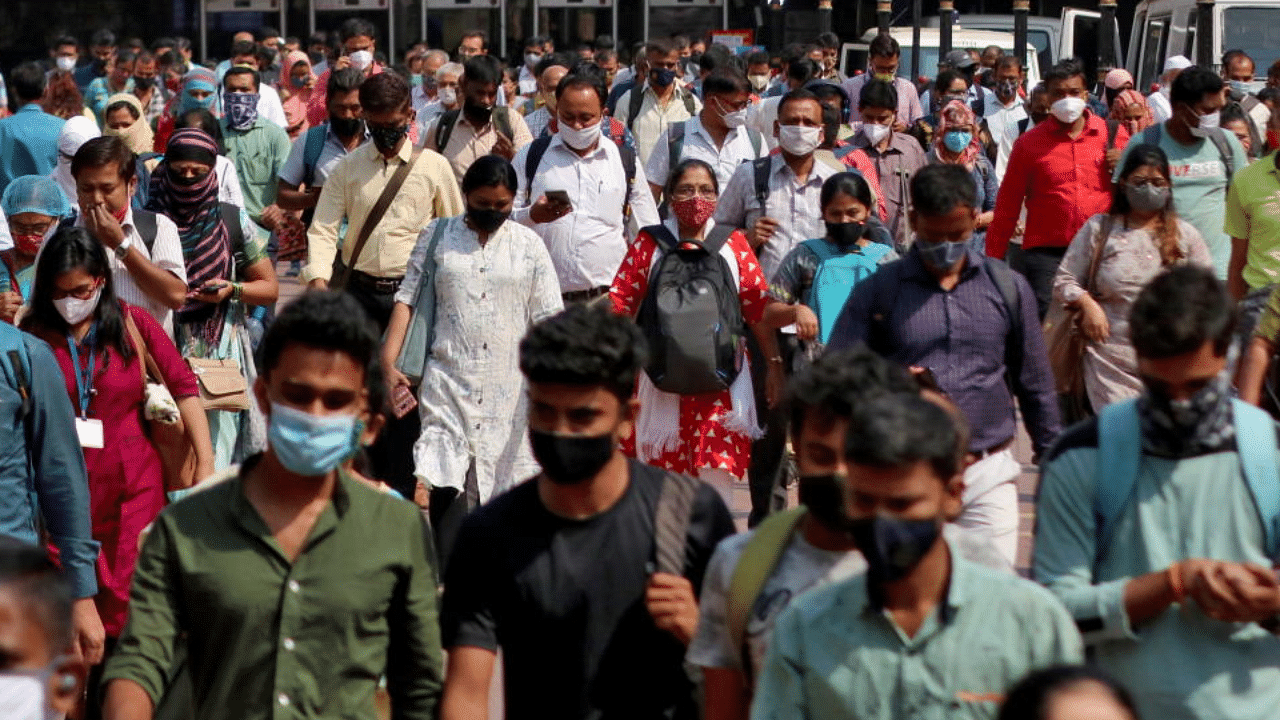 People wearing protective face masks leave the Chhatrapati Shivaji Terminus railway station, amidst the spread of the coronavirus disease, in Mumbai, India, March 16, 2021. Credit: Reuters Photo