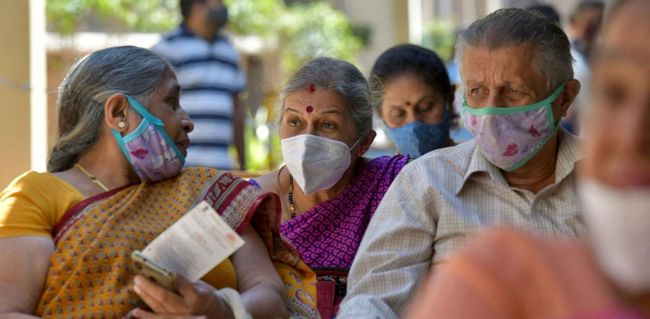 Senior citizens wait to receive coronavirus vaccine at a government hospital in Bangalore. Credit: AFP photo. 
