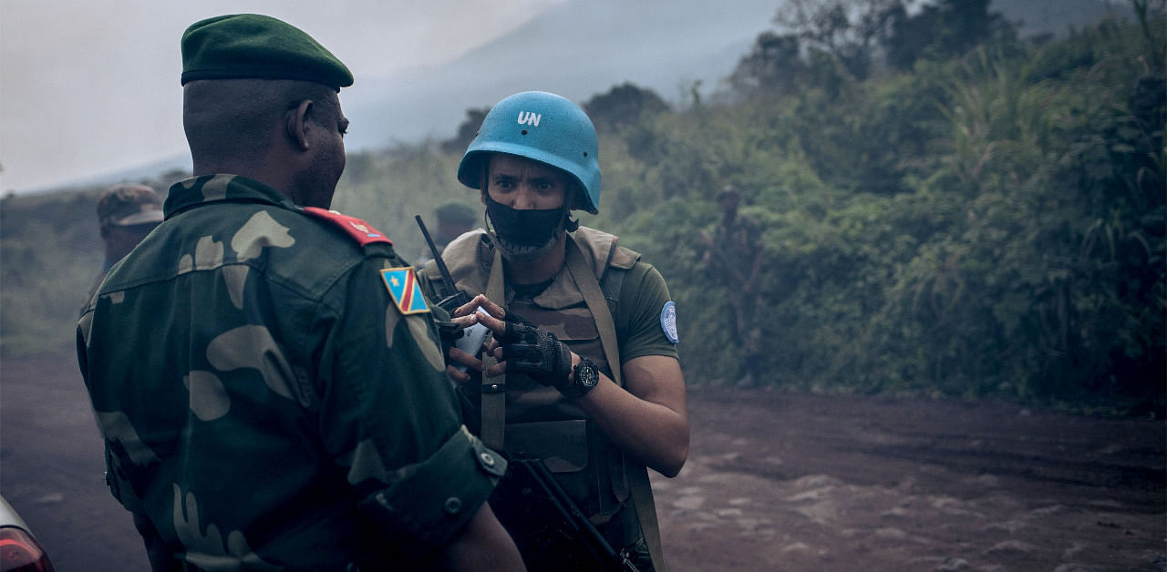 A Moroccan lieutenant of the MONUSCO (United Nations Organization Stabilization Mission in the DR Congo) speaks with Congolese armed forces general. Credit: AFP Photo