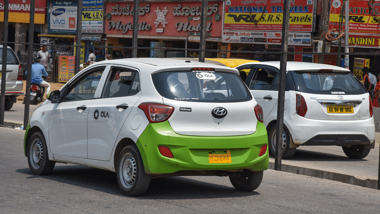 An Ola cab is seen on the road. Credit: DH Photo