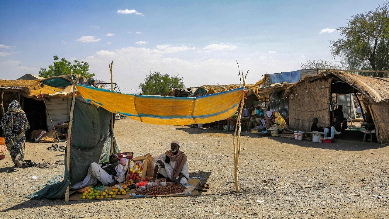 Merchants sit next to their merchandise of fruits and dried dates in Fashaqa farmland region - an area disputed by both Ethiopia and Sudan. Credit: AFP Photo