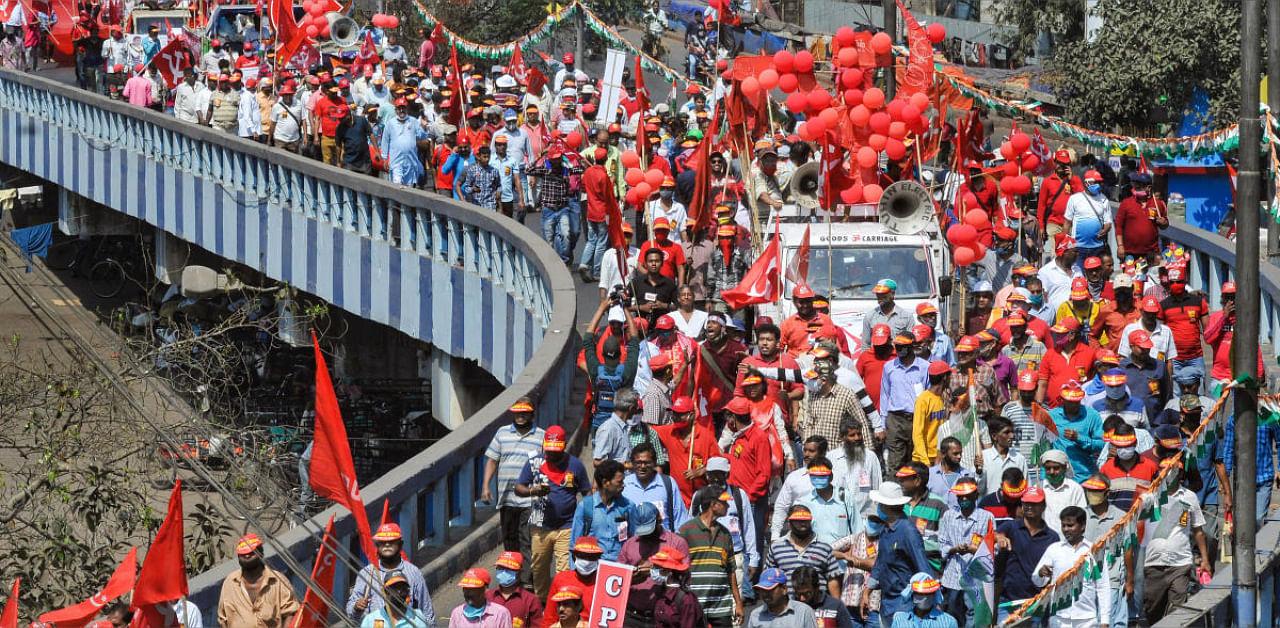CPI(M) workers participate in a march towards Brigade Parade Ground during mass Left Front and Congress joint rally ahead of West Bengal Assembly elections. Credit: PTI file photo. 