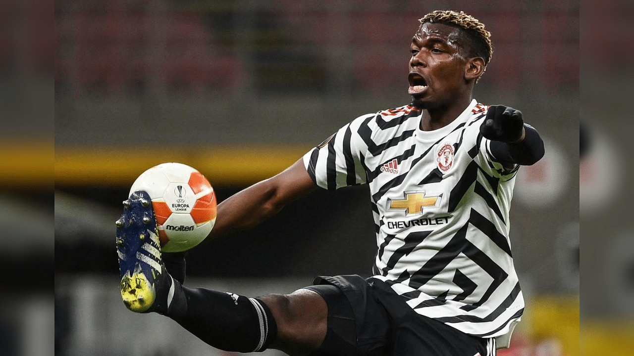 Manchester United's France's midfielder Paul Pogba controls the ball during the UEFA Europa League round of 16 second leg football match between AC Milan and Manchester United at San Siro stadium in Milan on March 18, 2021. Credit: AFP Photo