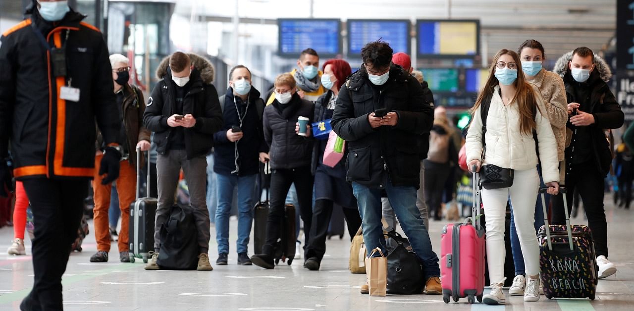 Parisians wait to board trains as Paris enters its third lockdown. Credit: Reuters Photo