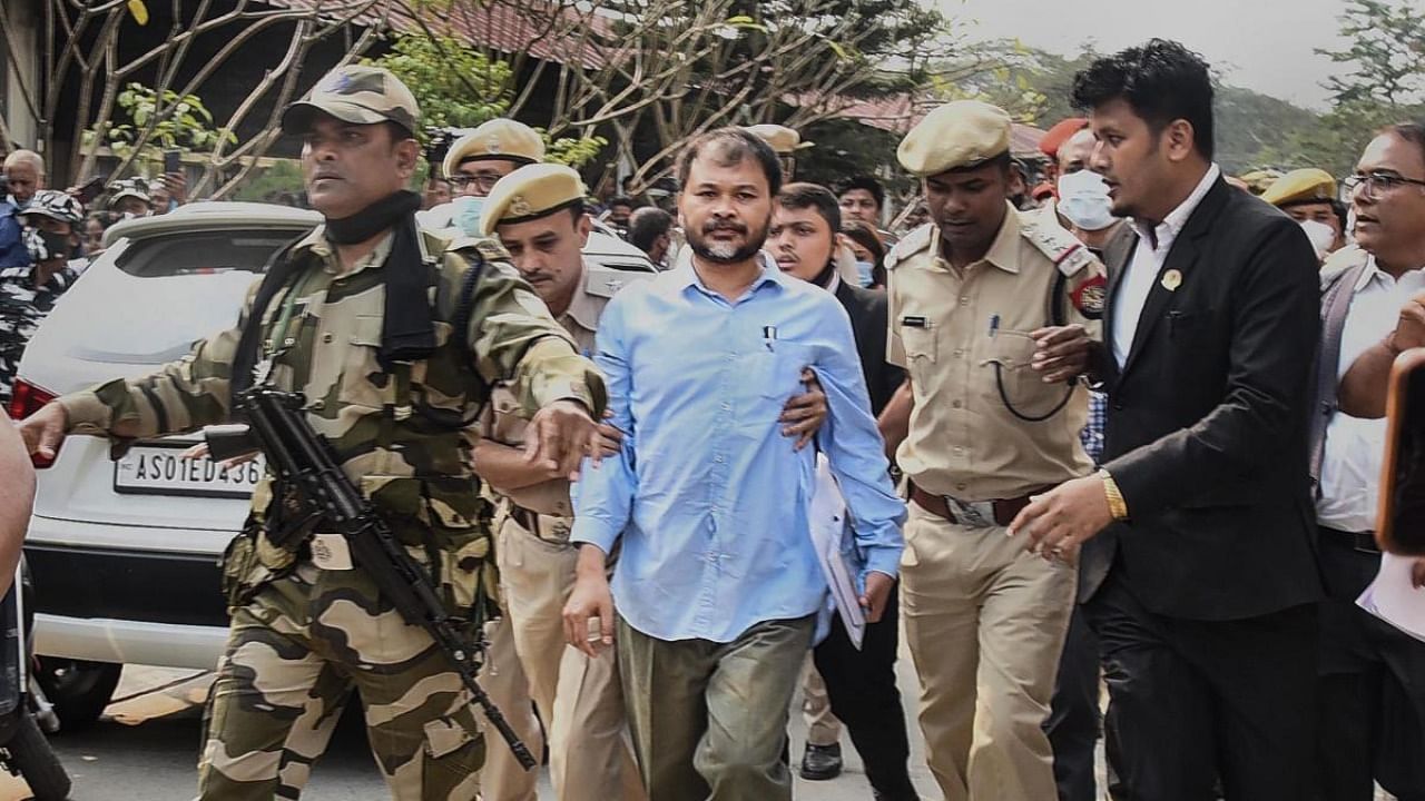 Raijor Dal candidate and jailed peasant activist Akhil Gogoi being taken by security personnel, after submitting his nomination papers to the returning officers via video-conference, ahead of the Assam Assembly polls, in Guwahati. Credit: PTI.