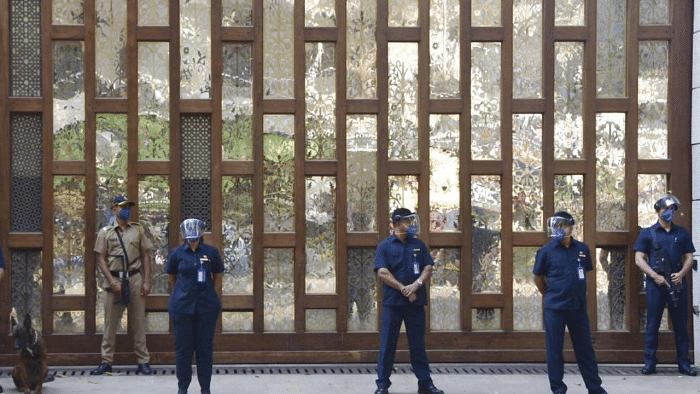 Police personnel guard outside industrialist Mukesh Ambai's residence Antilla, a day after explosives were found in an abandoned car in its vicinity, in Mumbai on Friday, Feb. 26, 2021. Credit: PTI Photo