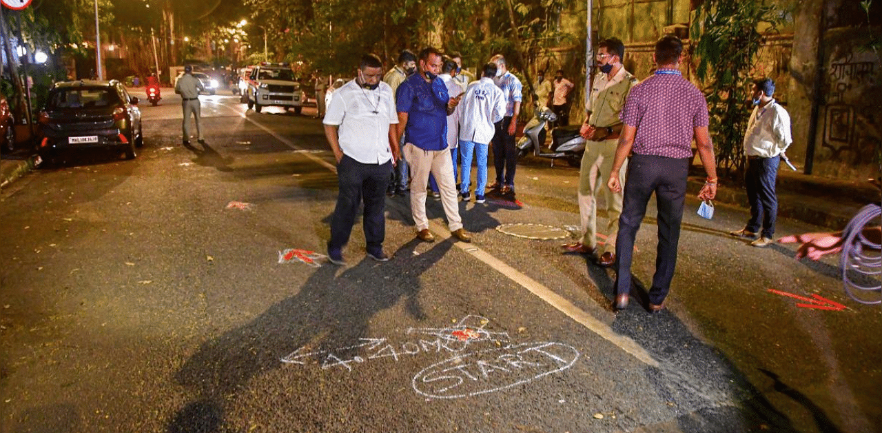 Central Forensic Science Laboratory, Pune (CFSL) team with NIA forensic experts recreate the crime scene by taking suspended API Sachin Vaze to the spot where the explosive-laden Scorpio was found outside Antilla. Credit: PTI Photo