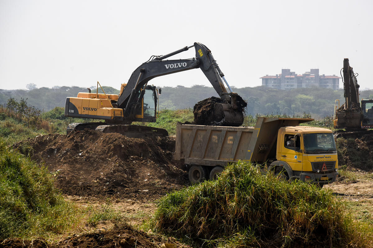 Silt being removed from Bellandur Lake, Bengaluru, on March 19, 2021. DH PHOTO/S K DINESH