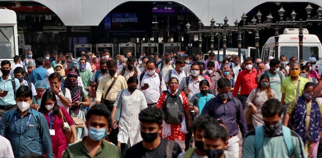 People wearing protective face masks leave the Chhatrapati Shivaji Terminus railway station, amidst the spread of the coronavirus disease in Mumbai. Credit: Reuters Photo