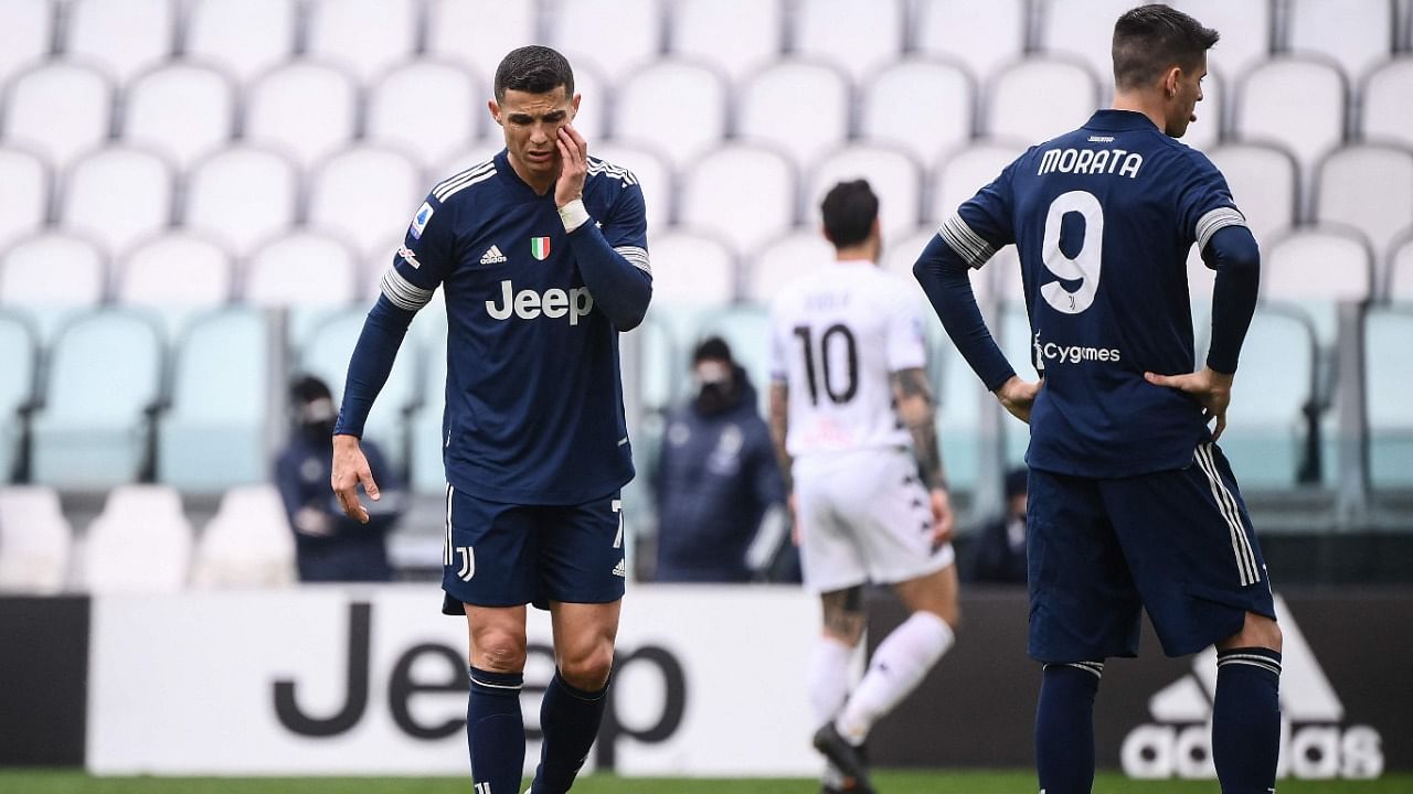 Juventus' Portuguese forward Cristiano Ronaldo (L) and Juventus' Spanish forward Alvaro Morata react during the Italian Serie A match Juventus and Benevento. Credit: AFP Photo