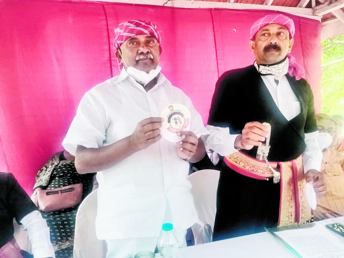 MLC Adagur H Vishwanath releases a logo during a seminar held in Capitol Village, on Sunday.