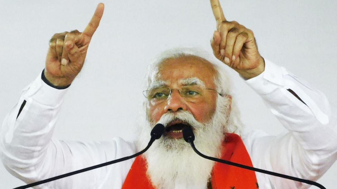 Prime Minister Narendra Modi addresses a public meeting ahead of the West Bengal Assembly Polls, in Bankura. Credit: PTI.