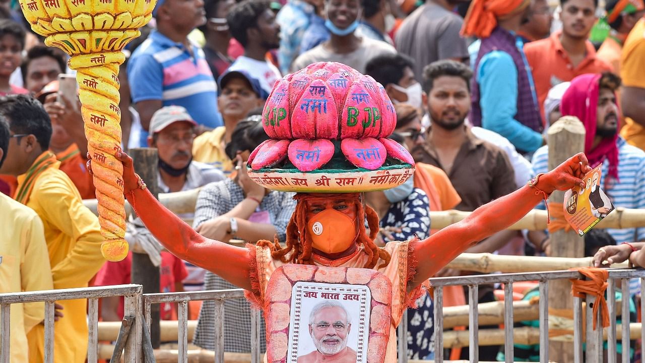 A BJP supporter at PM Modi's rally in West Bengal. Credit: PTI Photo