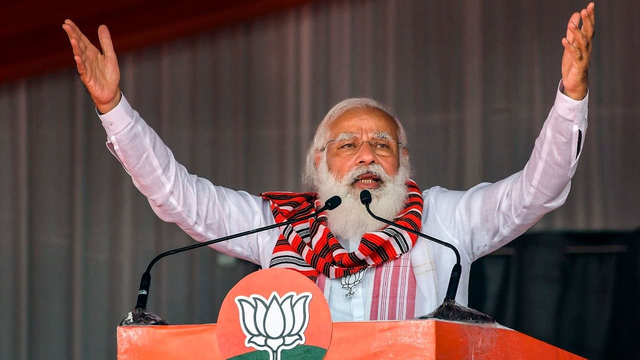 Prime Minister Narendra Modi addresses an election campaign rally for Assam Assembly polls, at Bokakhat in Golaghat district, Sunday, March 21, 2021. Credit: PTI Photo