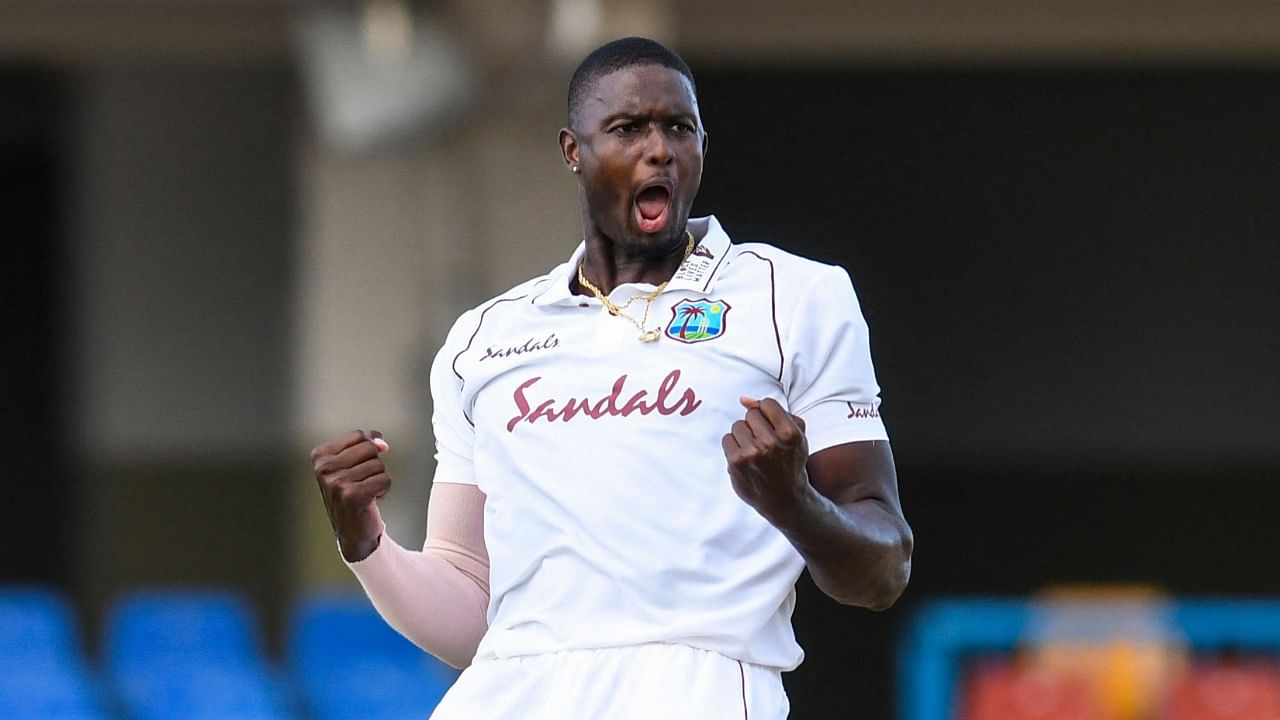 Jason Holder of the West Indies celebrates the dismissal of Lasith Embuldeniya of Sri Lanka during day 1 of the 1st Test between West Indies and Sri Lanka at Vivian Richards Cricket Stadium in North Sound, Antigua and Barbuda, on March 21, 2021. Credit: AFP Photo