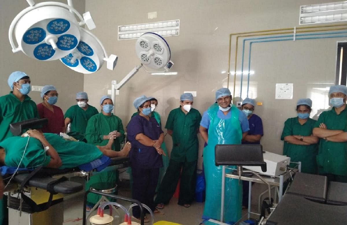 The doctor and team members in an online interaction with experts after the surgery, at Santhemarahalli in Chamarajanagar district on Sunday. DH Photo