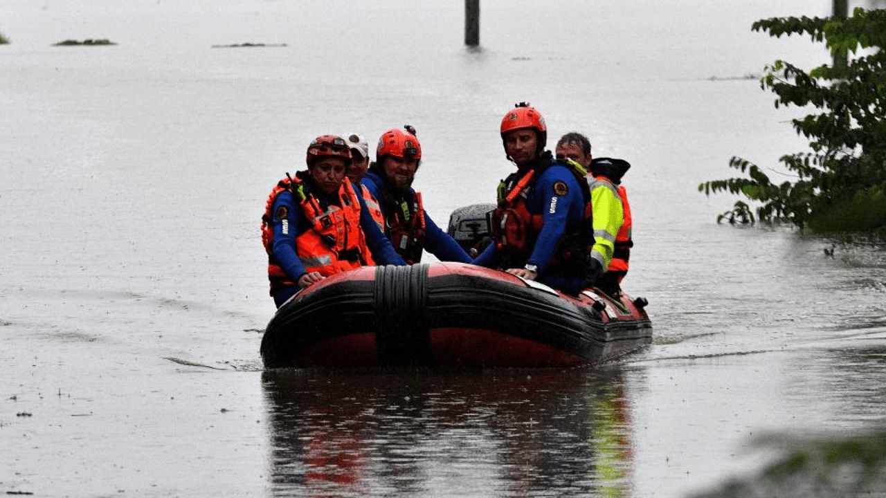 State Emergency Service volunteers patrol a flooded residential area in Richmond on March 22, 2021, as torrential downpours lashed Australia's east forcing thousands to flee the worst flooding in decades. Credit: AFP Photo