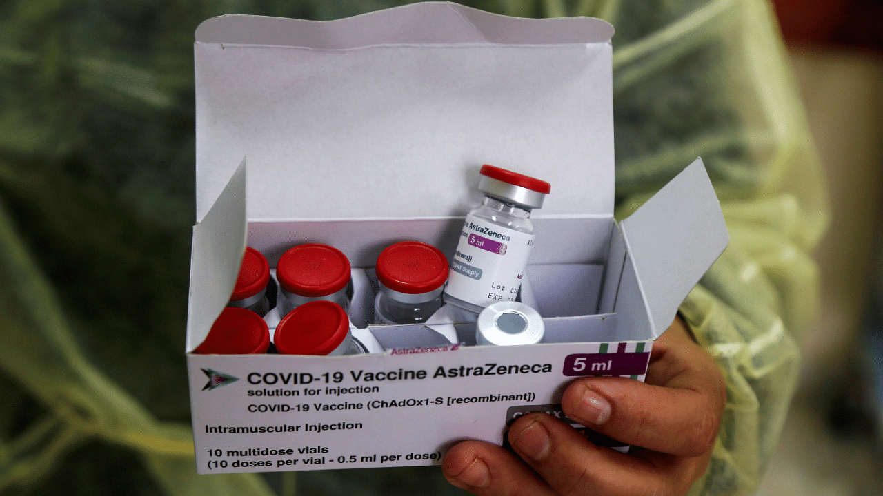 A health worker holds a box contains vials of AstraZeneca vaccine. Credit: Reuters Photo