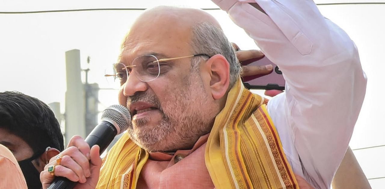 Union Home Minister Amit Shah during an election campaign roadshow in support of BJP candidates, ahead of Assembly polls, in Midnapur town, Monday, March 23, 2021. Credit: PTI Photo