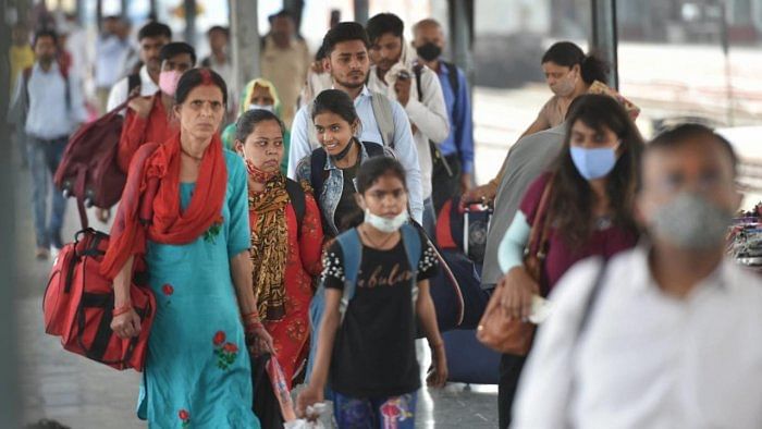 Passengers not wearing masks arrive at Charbagh Railway Station amid the Covid-19 pandemic, in Lucknow. Credit: PTI Photo