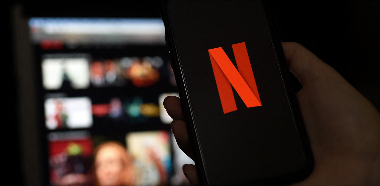 Illustration a computer and a mobile phone screens display the Netflix logo. Credit: AFP Photo