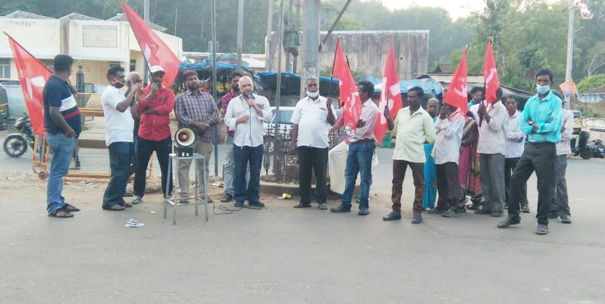 CPM leader Dr I R Durgaprasad speaks at a protest in Siddapura.