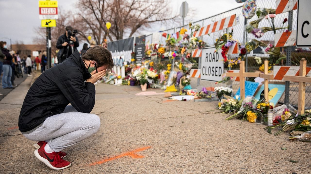 A man cries at the site of a shooting at King Soopers grocery store in Boulder, Colorado, US March 24, 2021. Credit: Reuters Photo