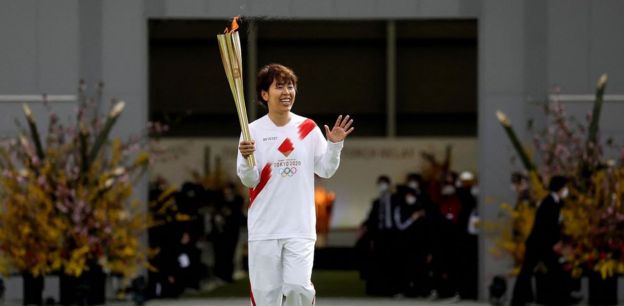 Japanese torchbearer Azusa Iwashimizu, a member of Japan women's national football team. Credit: AFP Photo