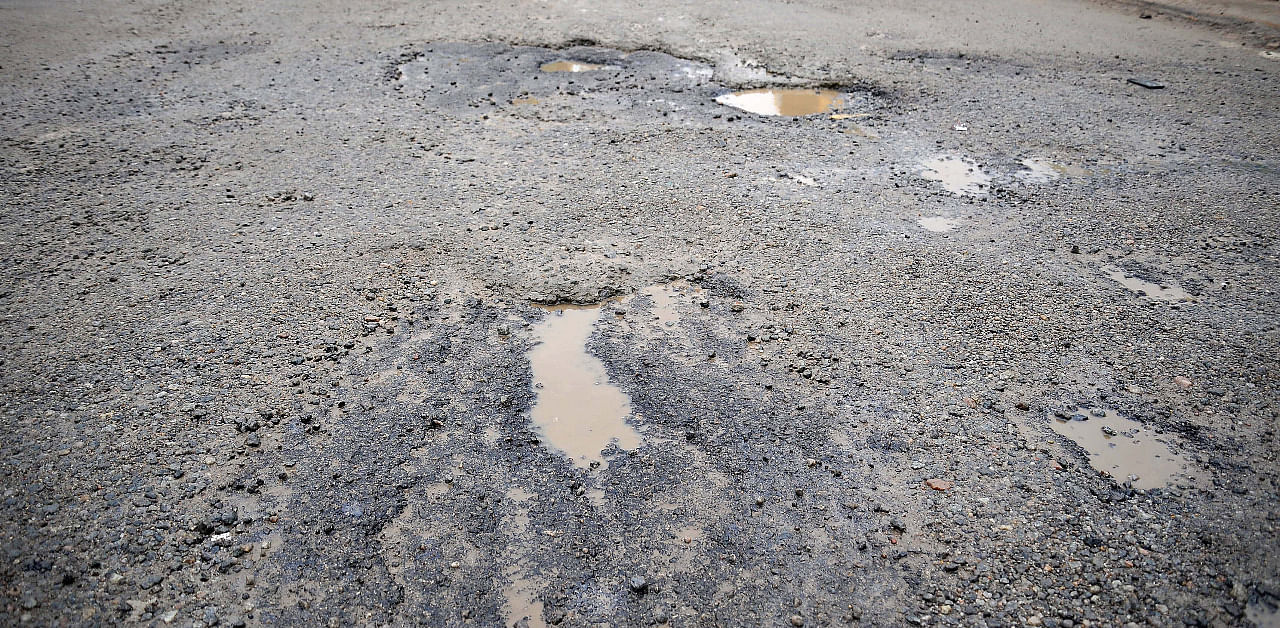 Potholes seen on Bengaluru roads. Credit: DH Photo/Pushkar V