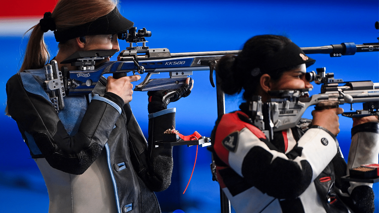 Natalia Kochanska of Poland (L) and Gaayathri Nithyanandam compete in the 50m rifle 3 position team women's final during the ISSF World Cup 2021 at the Karni Singh shooting range in New Delhi. Credit: AFP Photo