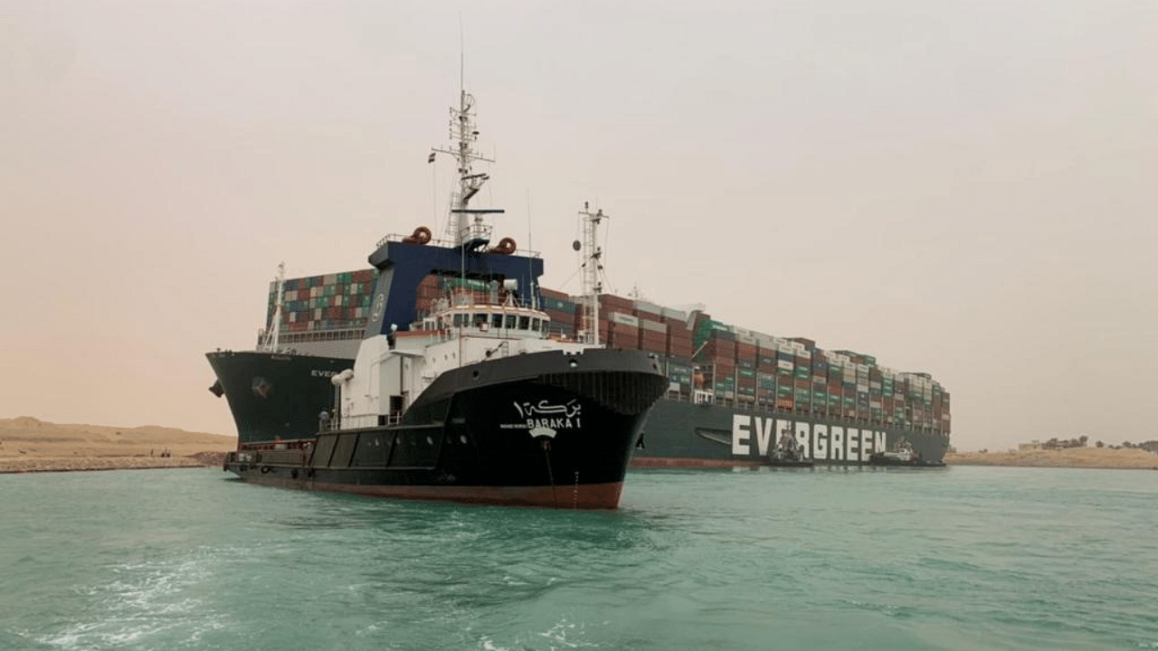 A container ship which was hit by strong wind and ran aground is pictured in Suez Canal, Egypt. Credit: Reuters Photo