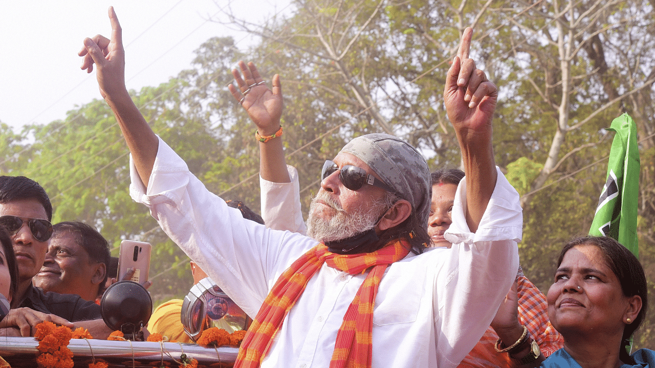 Veteran actor and BJP leader Mithun Chakraborty during a roadshow in support of party candidate Sonali Murmu. Credit: PTI Photo