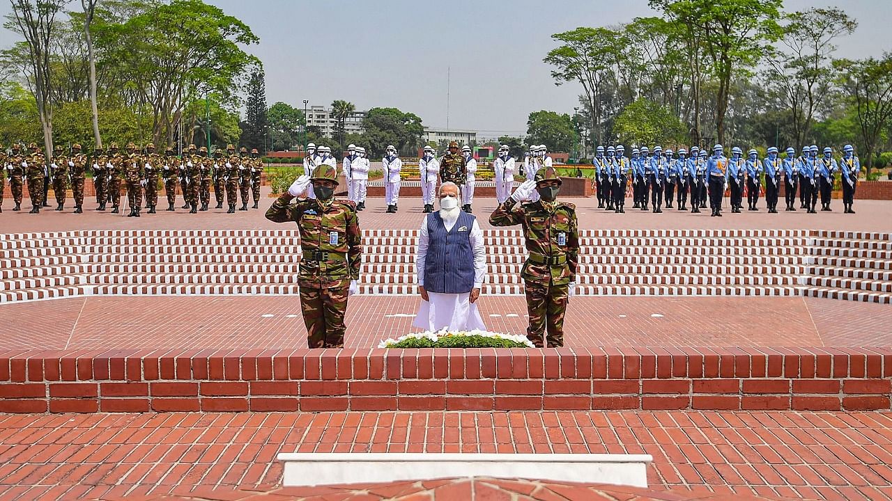 Prime Minister Narendra Modi pays homage at the National Martyr’s Memorial, Savar, in Dhaka. Credit: PTI Photo