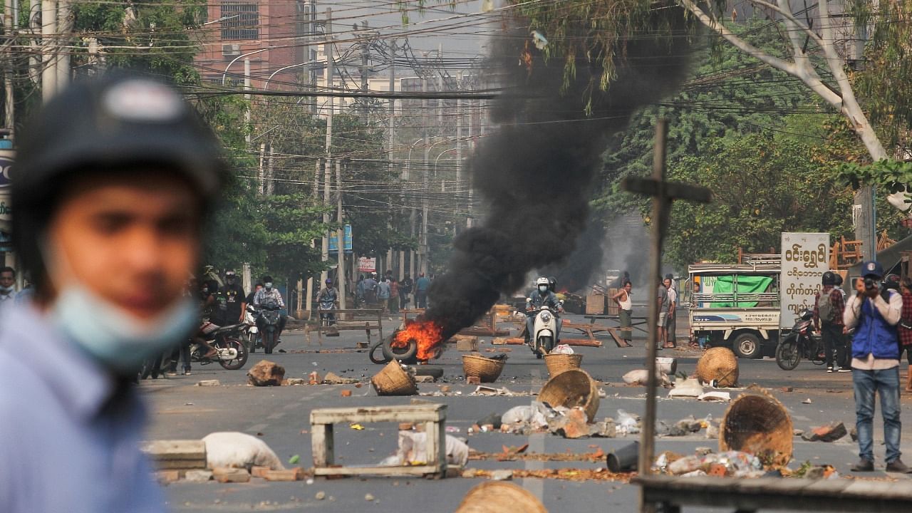 Tires burn on a street as protests against the military coup continue, in Mandalay, Myanmar March 27, 2021. Credit: AFP Photo