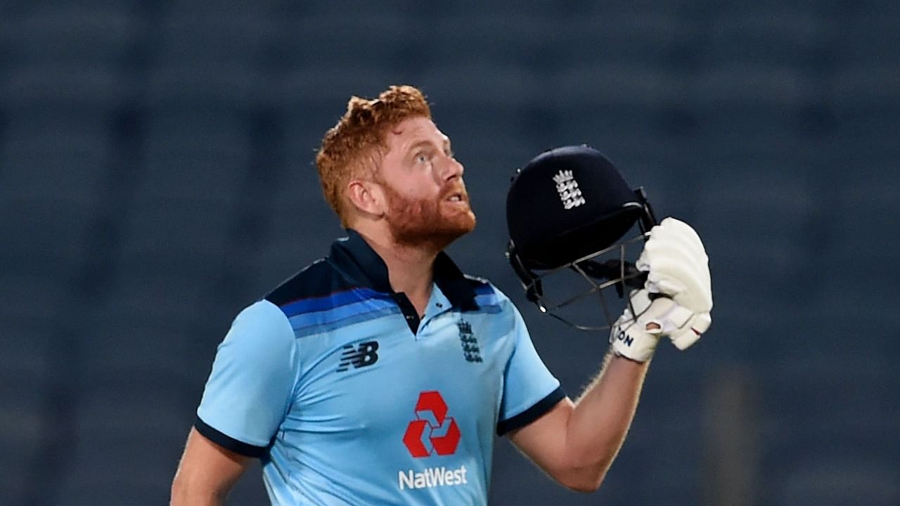 England's Jonny Bairstow celebrates after scoring a century (100 runs) during the second one-day international (ODI) cricket match between India and England at the Maharashtra Cricket Association Stadium in Pune on March 26, 2021. Credit: AFP Photo