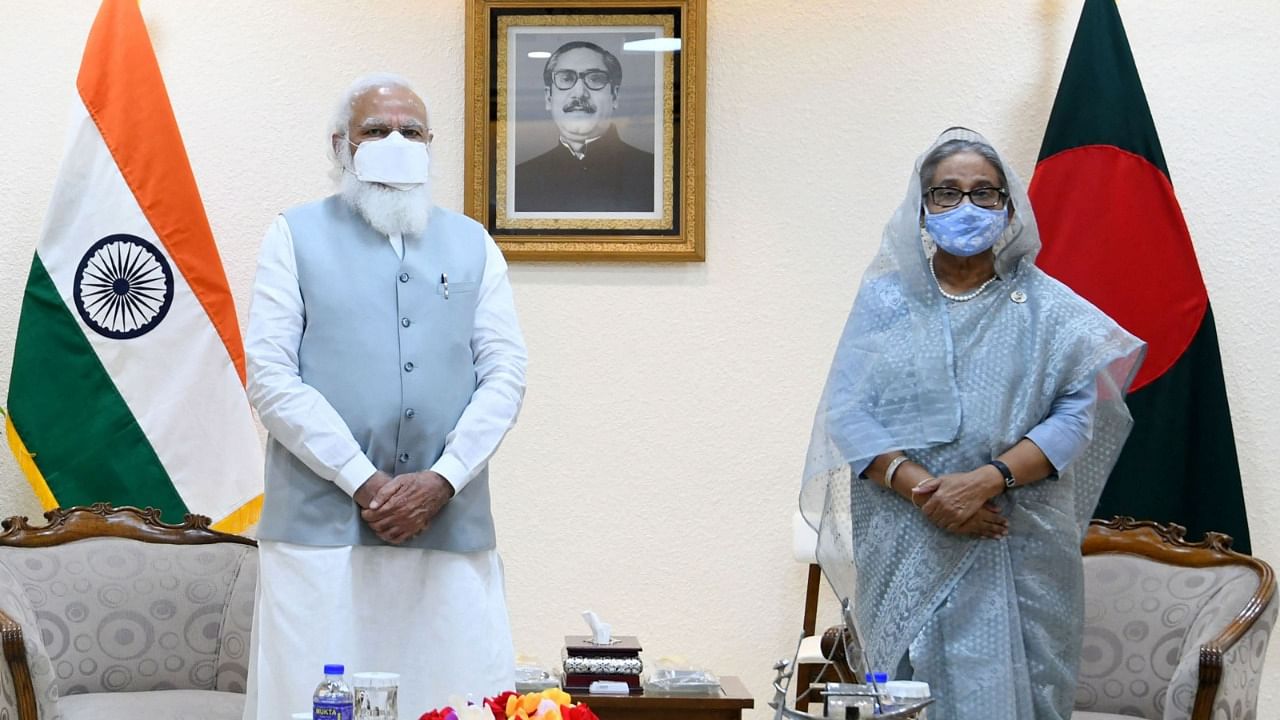 Indian Prime Minister Narendra Modi (L) and his Bangladesh's counterpart Sheikh Hasina before their meeting in Dhaka. Credit: PTI Photo