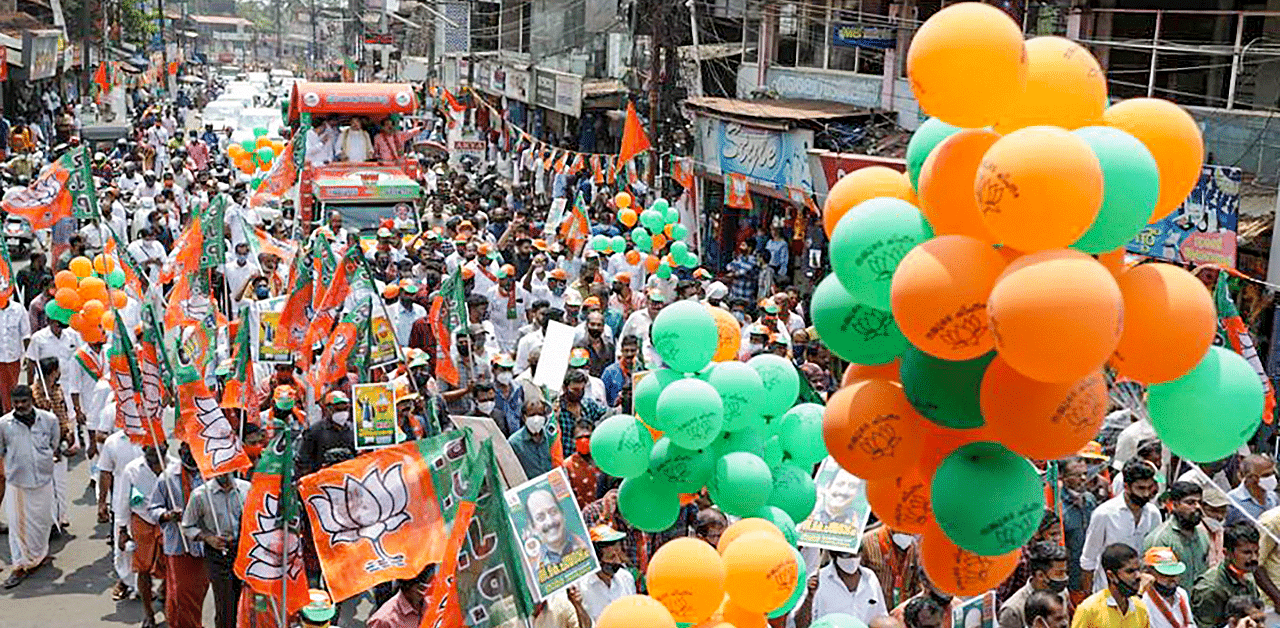 BJP National President J.P. Nadda during a road show from Nalampeedika to Chakkarakkal ahead of Assembly polls, in Dharmadom constituency. Credit: PTI Photo