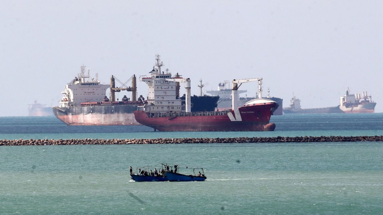 Ships and boats are seen at the entrance of Suez Canal, which was blocked by stranded container ship Ever Given that ran aground. Credit: Reuters Photo